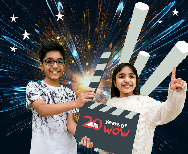 Science show promotional image showing a boy holding a clackerboard and a girl smiling with her hand in the air