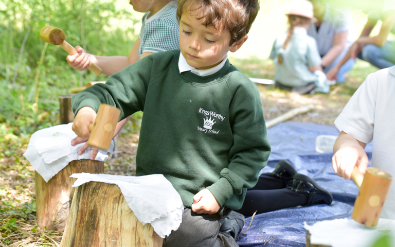 School children looking for bugs at the Butterfly Conservation reserve in Winchester