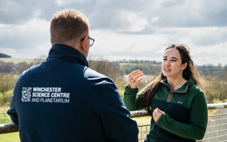 TV presenter Megan McCubbin talks to members of staff from Winchester Science Centre outside