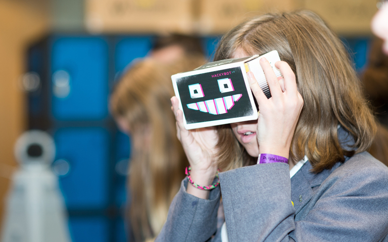 A school student uses a homemade eyeviewer