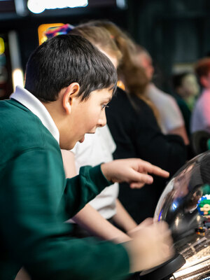 A child looks amazed by a science centre exhibit