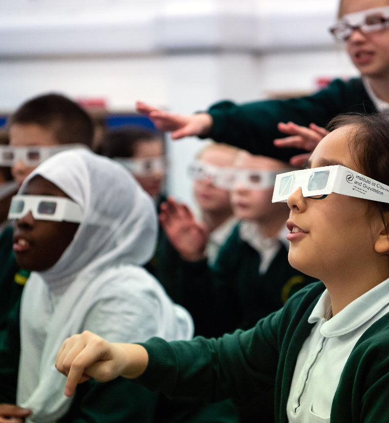 School children wearing diffraction glasses in a school workshop