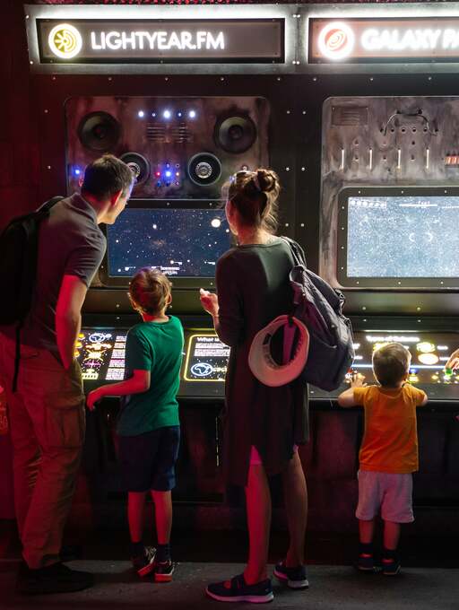 Interactive science exhibition photo showing two children engaging with an exhibit